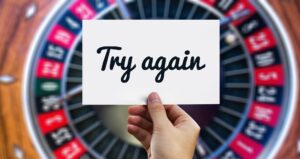 The words "try again" over a roulette wheel.
